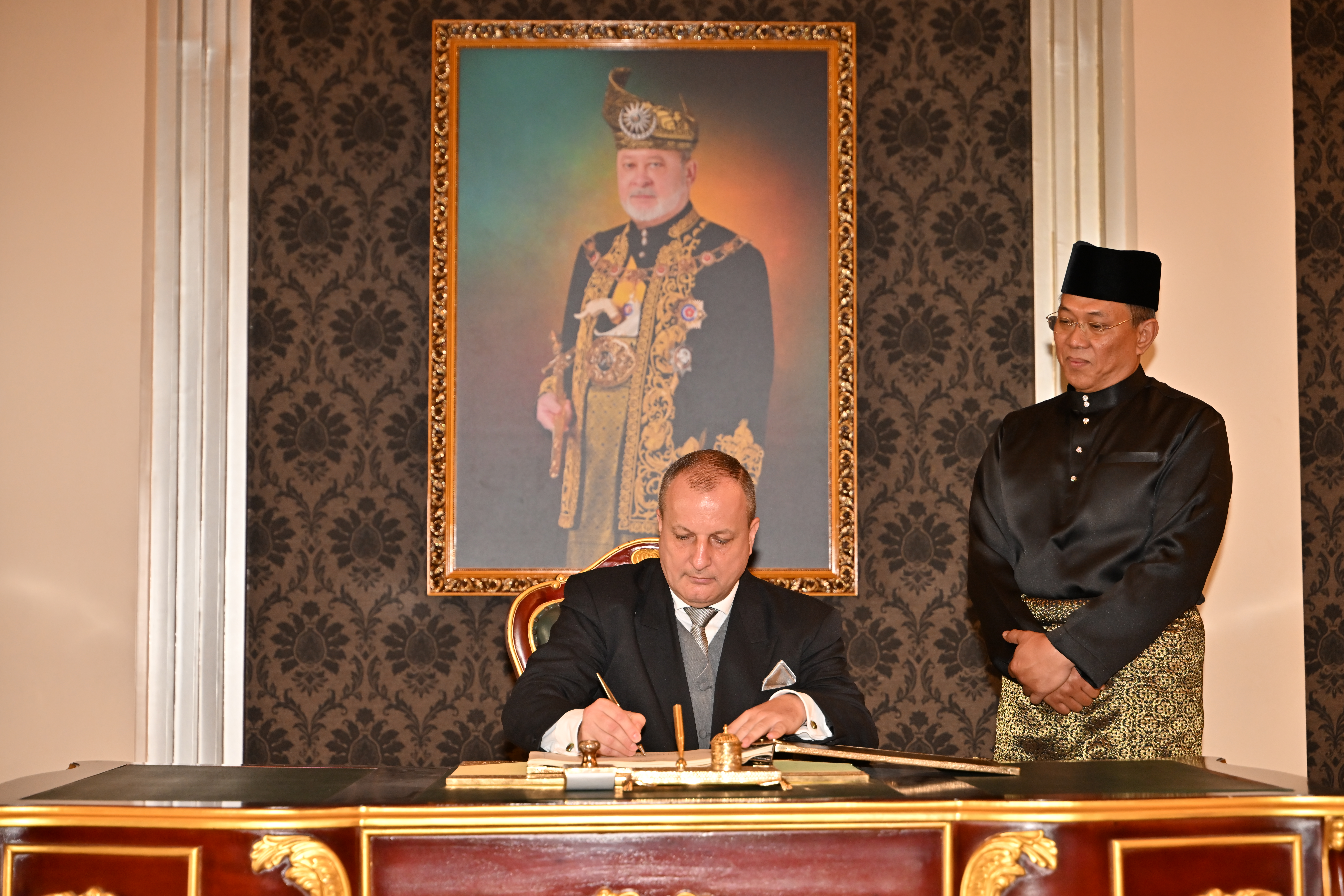 Dr Sandor Sipos signs